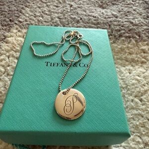 Tiffany & Co. Notes Alphabet disc charm pendant. Letter “P”